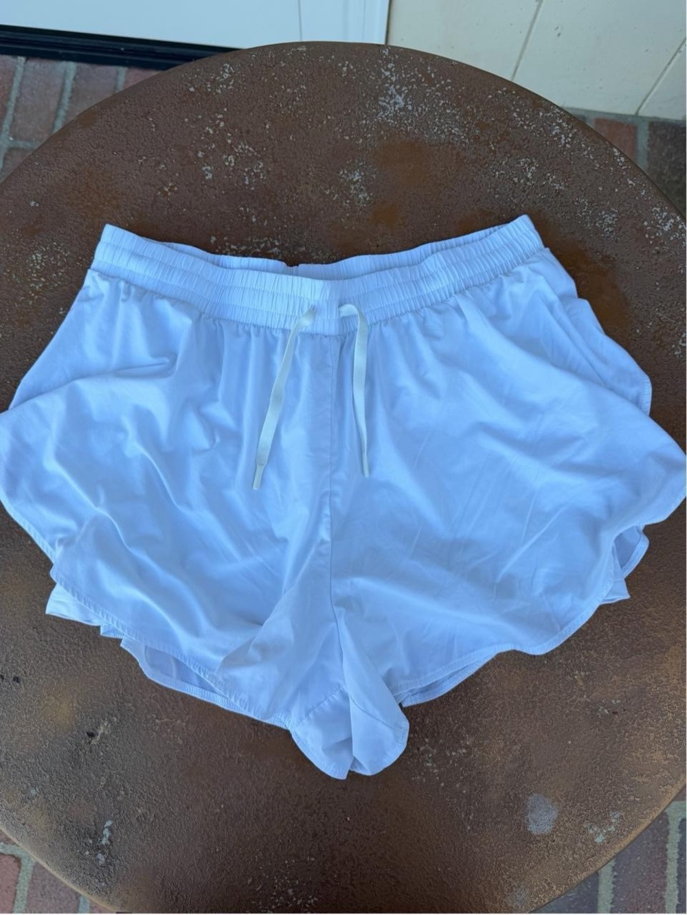 White all in motion flowy white running/ exercise shorts with built in spandex